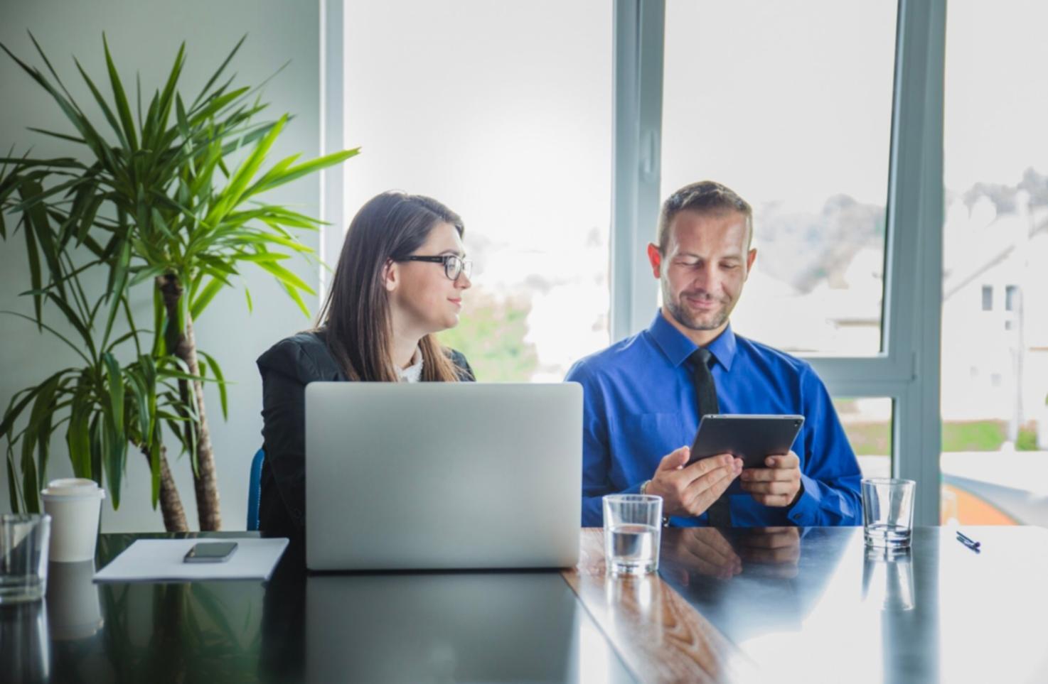 Professional analyzing financial data and budget forecasts on multiple screens
